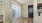 An unfurnished dining room in the apartment, featuring bare floors and walls, awaiting personal touches and furniture to create a cozy dining area.